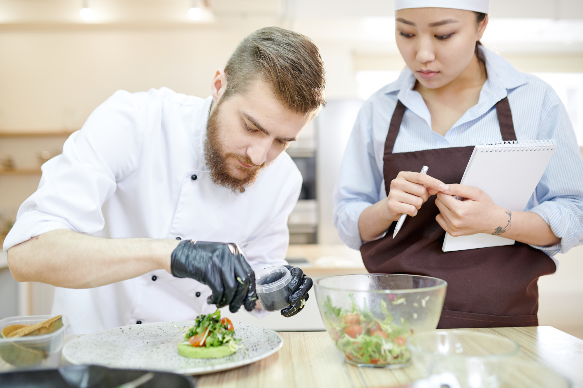 Instructor demonstrating plating to a small group